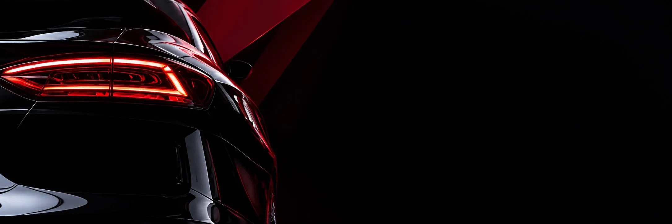 Close-up of a luxury car's illuminated taillight